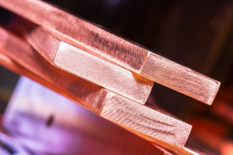 closeup-of-stacked-polished-copper-bars-with-a-soft-purple-and-orange-background-PoMG5V-800×533-1