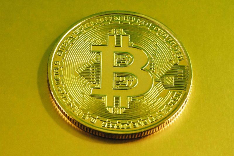 gold-bitcoin-coin-with-a-digital-circuit-pattern-on-a-yellow-background-m3Nuef-800×533-1
